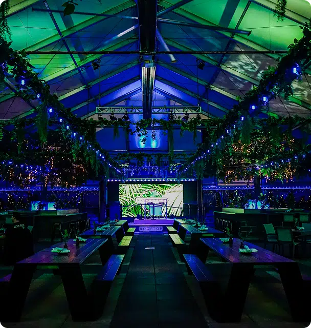 A venue lit in soft green and blue by Gemstone Lights