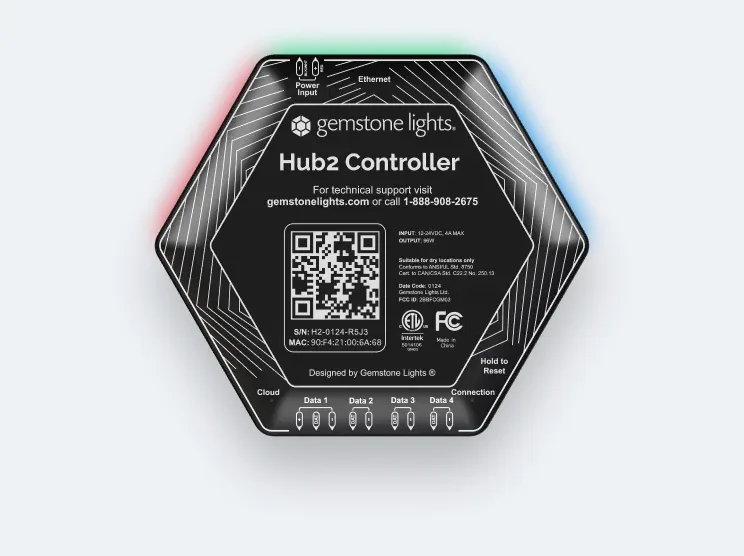 The Gemstone Lights Hub2 controller, a black hexagon with four outputs