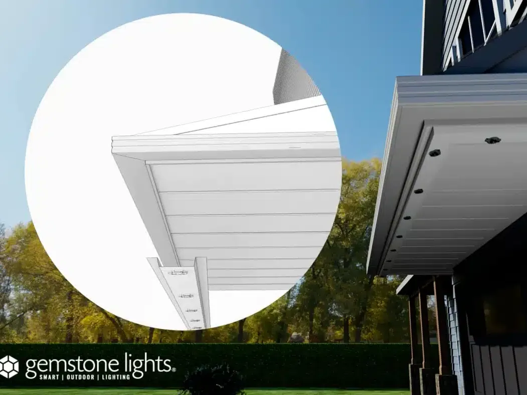 Diagram showing a light track fastened under a soffit beside the fascia trim of a home
